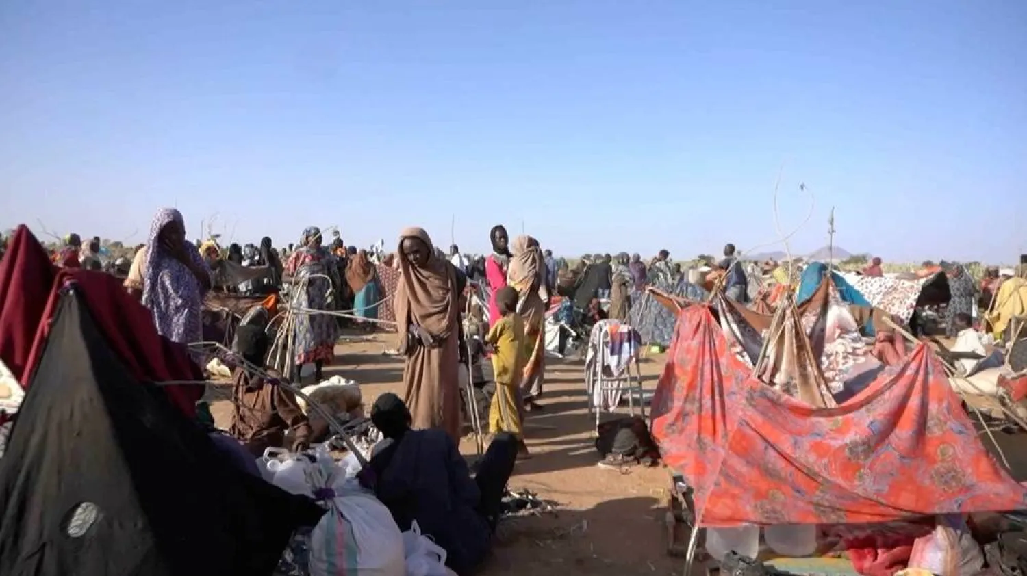  Displaced Sudanese gather and sit in makeshift tents after fleeing el-Fasher city in Darfur, in Tawila, Sudan, October 29, 2025, in this still image taken from a Reuters' video. (Reuters)