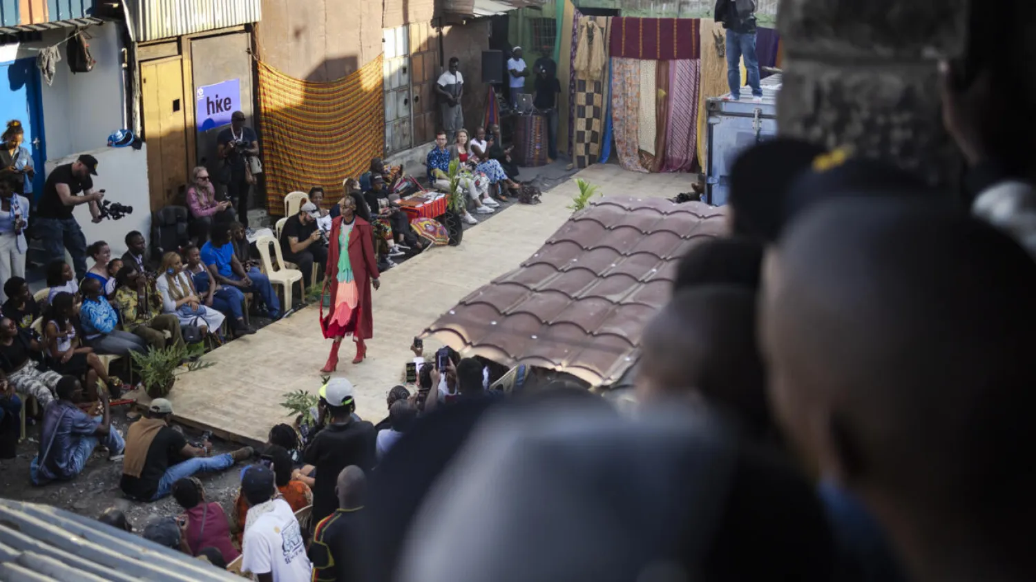 Models show off outfits created by local fashion designers specialising in upcycling discarded fabrics and garments from second-hand clothes markets. Tony KARUMBA / AFP