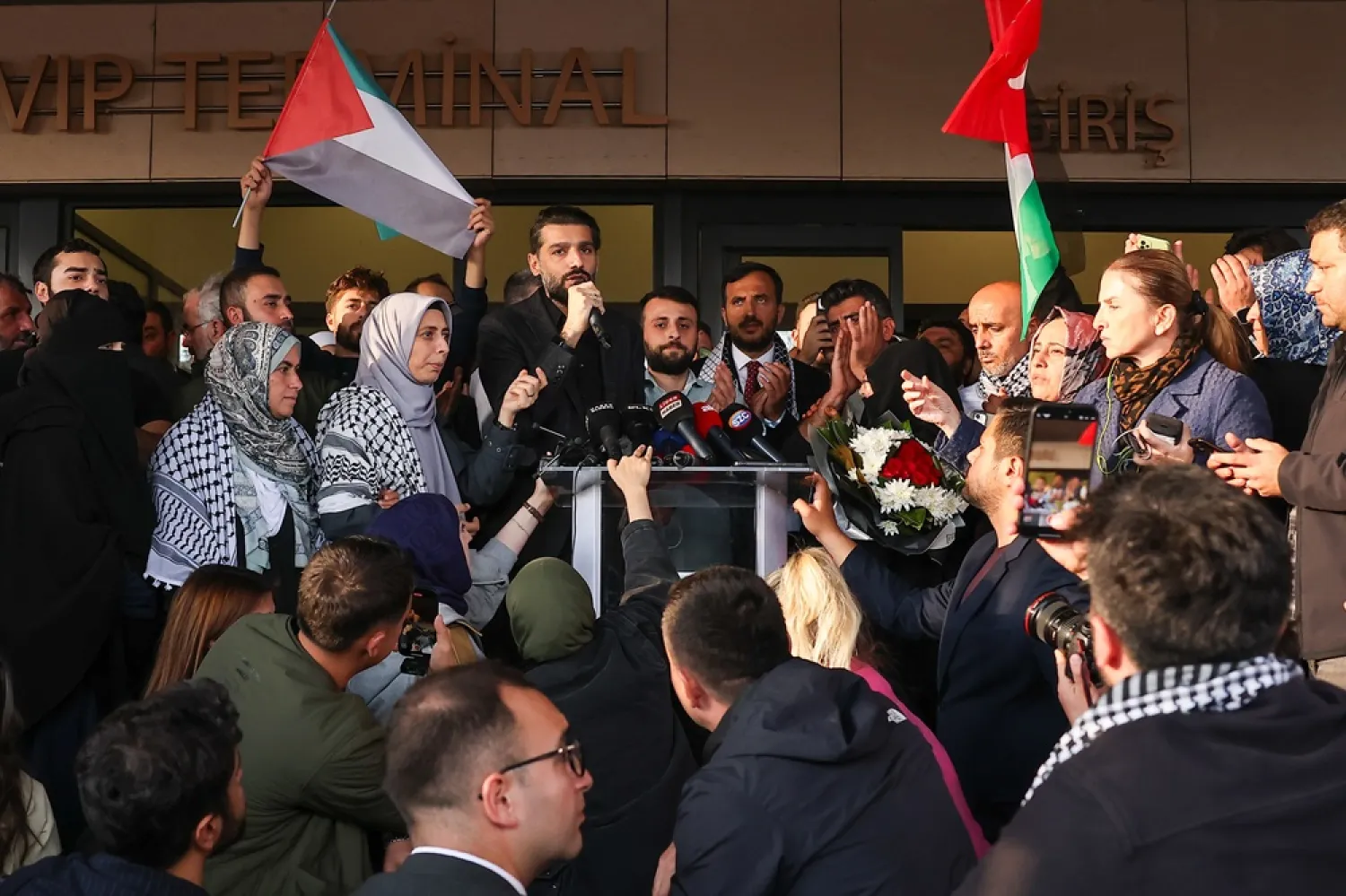 Turkish activists who participated in the Global Sumud Flotilla (GSF) speak to the media after returning home following Israel's interception of GSF vessels, in Istanbul, Türkiye, 04 October 2025. (EPA) 
