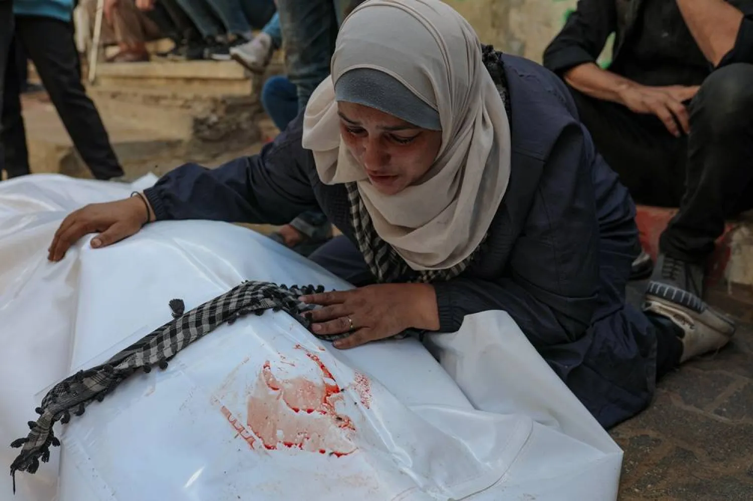 Palestinians mourn the death of a relative at Al Shifa hospital in Gaza City, 29 October 2025. (EPA)