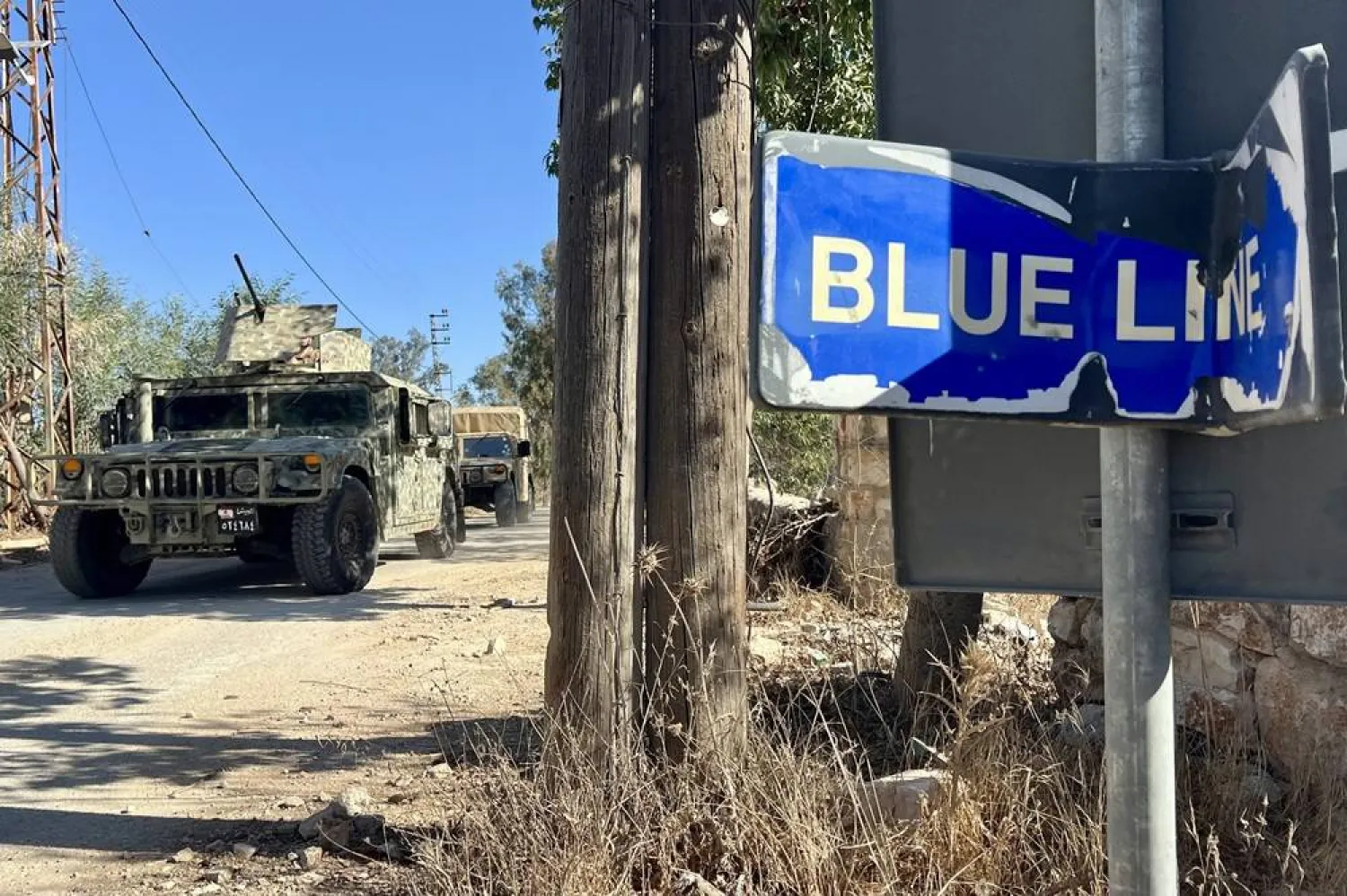 Lebanese army soldiers stand guard at the site where Lebanese municipal employee Ibrahim Salameh was killed in the village of Blida in southern Lebanon, 30 October 2025. (EPA)