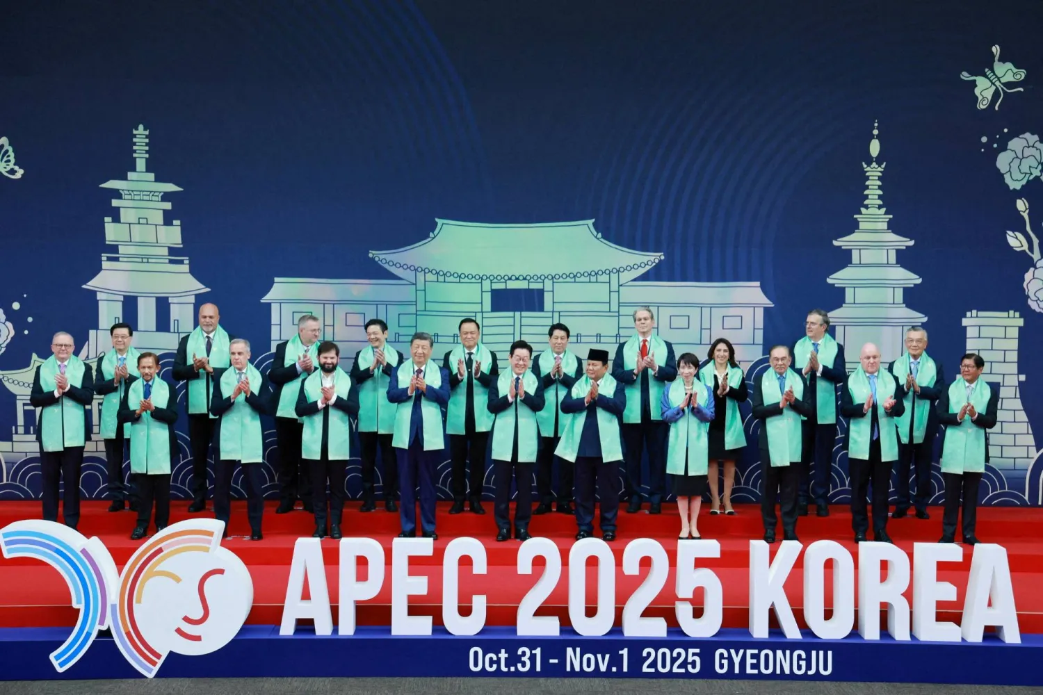 World leaders pose for a group photo during the Asia-Pacific Economic Cooperation (APEC) summit in Gyeongju, South Korea, November 1, 2025. Yonhap via REUTERS