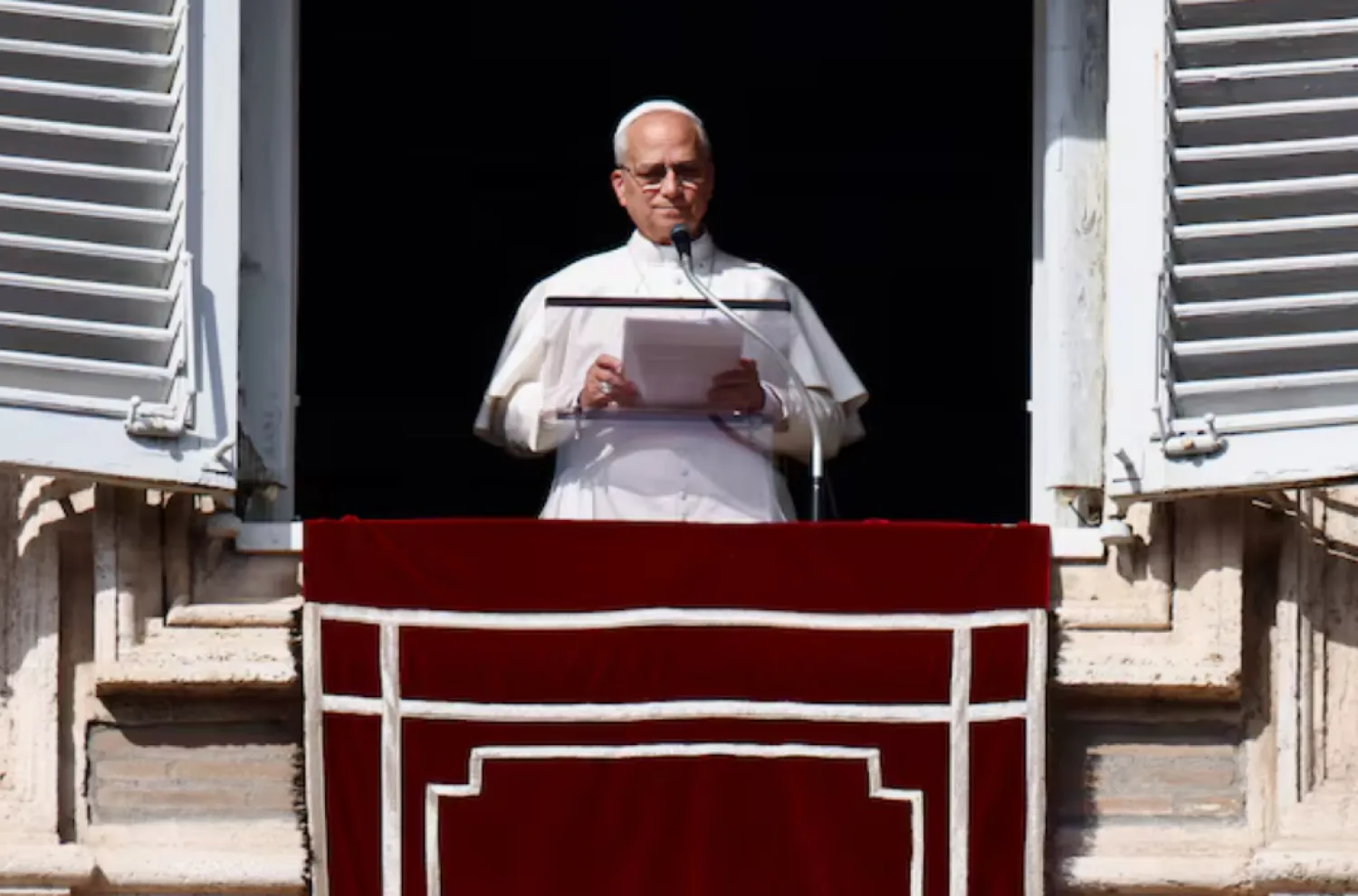 Pope Leo XIV leads the Angelus prayer from the window of the Apostolic Palace at the Vatican, November 2, 2025. REUTERS/Vincenzo Livieri 