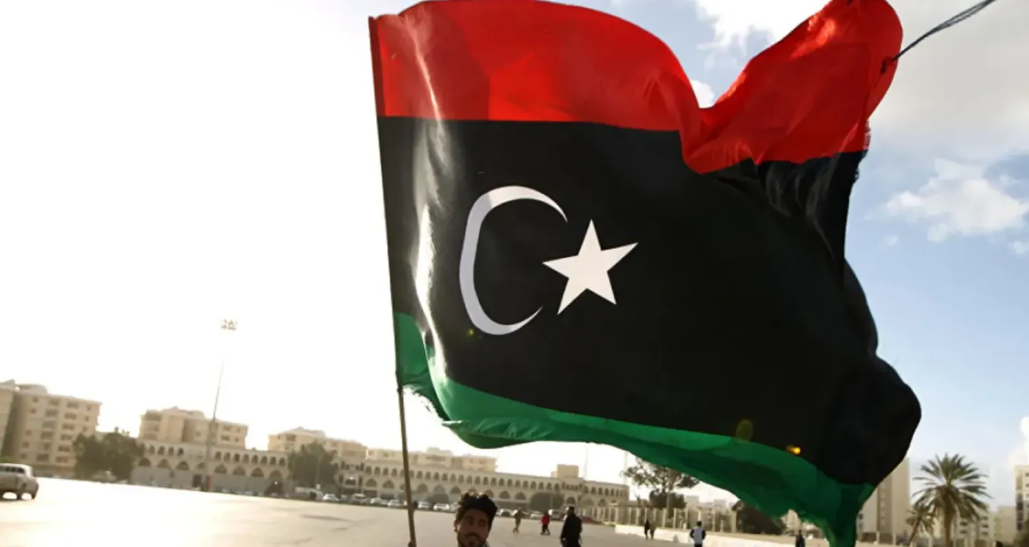 Man waving the Libyan flag - File Photo/AFP
