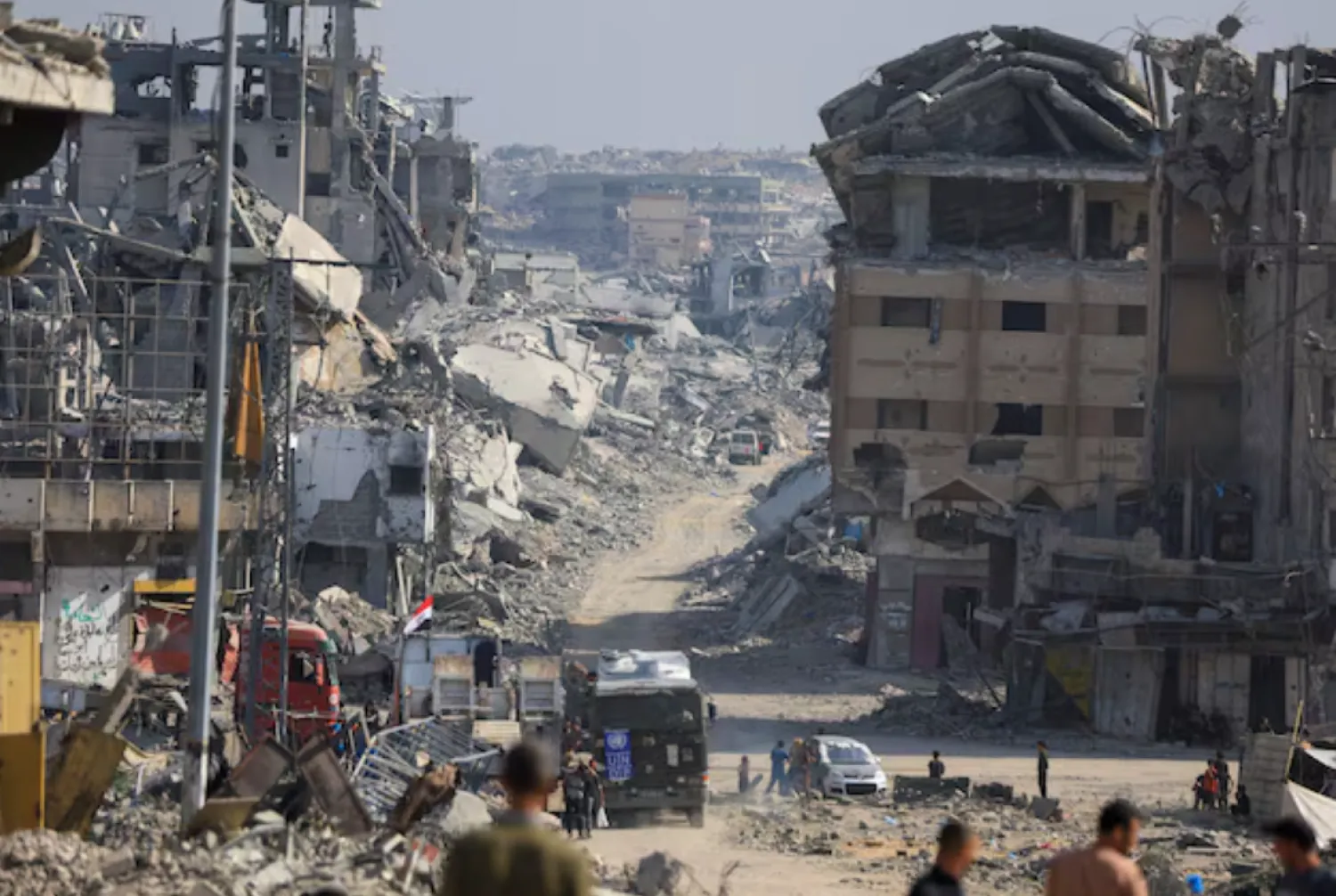 Palestinians gather as Red Cross personnel work in an area within the so-called "yellow line" to which Israeli troops withdrew under the ceasefire, as Hamas says it continues to search for the bodies of deceased hostages seized during the October 7, 2023, attack on Israel, in Gaza City November 2, 2025. REUTERS/Dawoud Abu Alkas