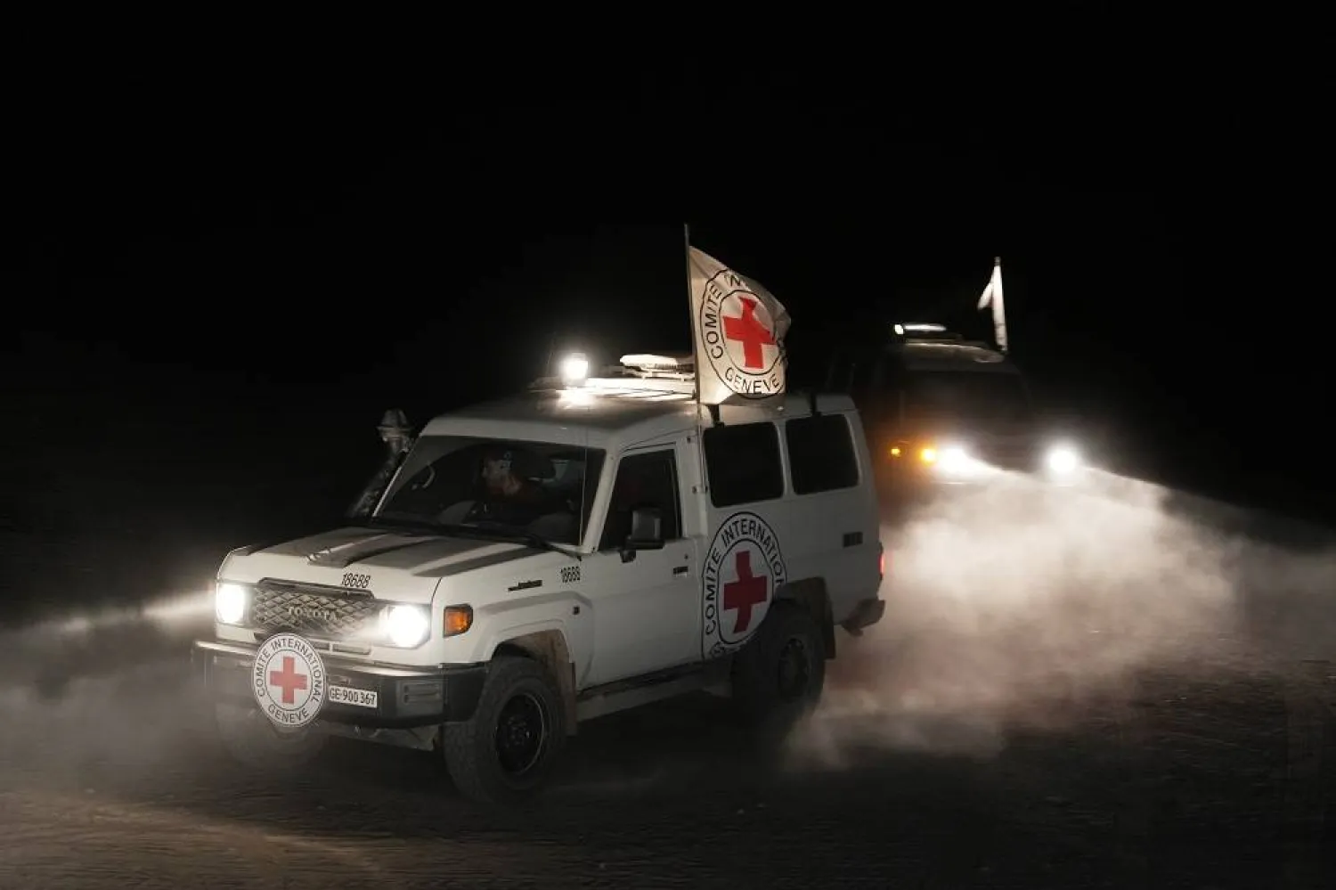 Red Cross vehicles carrying the bodies of three people believed to be deceased hostages handed over by Hamas make their way toward the border crossing with Israel, to be transferred to Israeli authorities, in Deir al-Balah, central Gaza Strip, Sunday, Nov. 2, 2025. (AP)