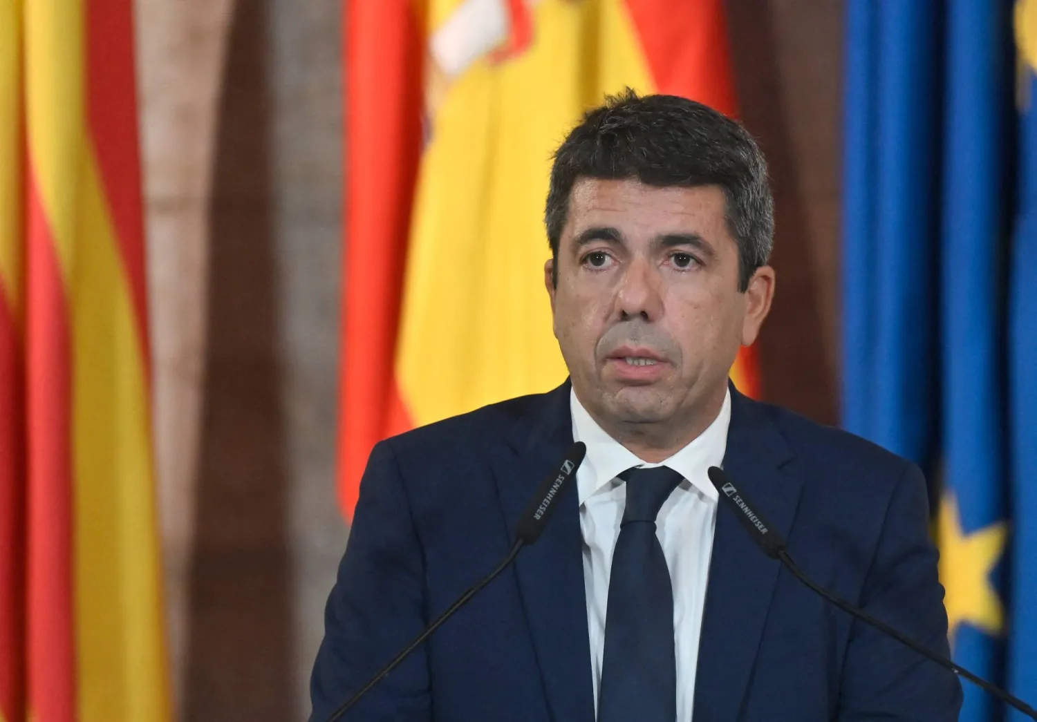 President of Valencia's Region Carlos Mazón gives a press conference to announce his resignation at Valencia's Palau de la Generalitat on November 3, 2025. (AFP) 