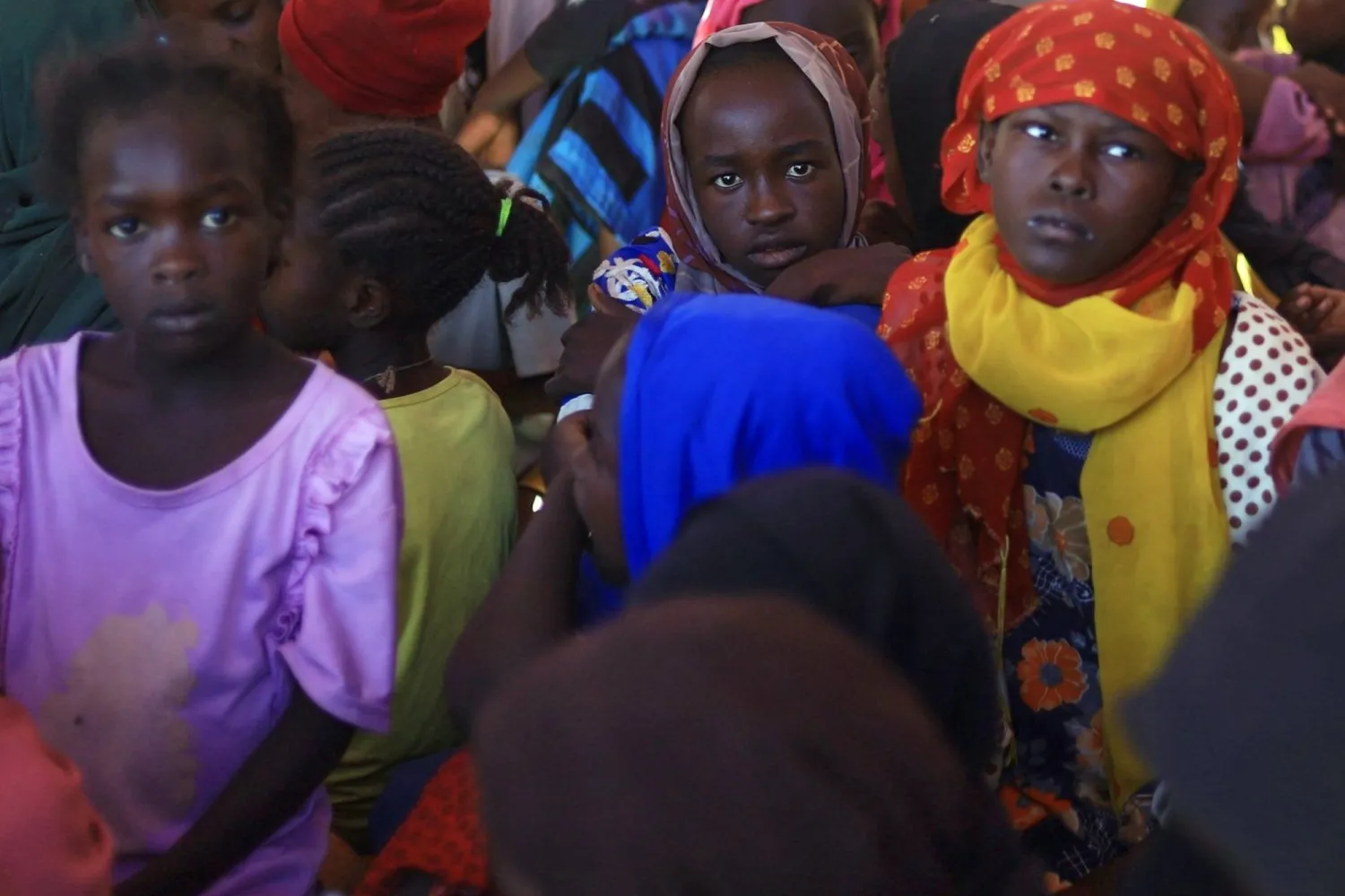  This photo released by The Norwegian Refugee Council (NRC), shows displaced women and children from el-Fasher at a camp where they sought refuge from fighting between government forces and the RSF, in Tawila, Darfur region, Sudan, Monday, Nov. 3, 2025. (NRC via AP) 