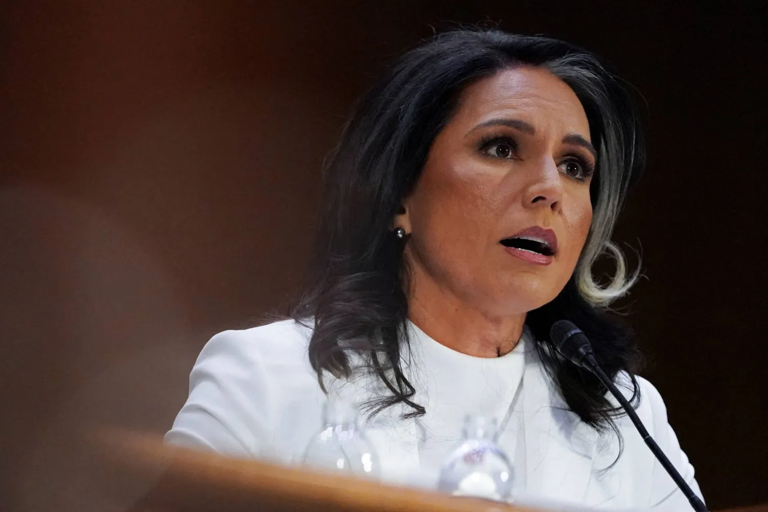FILE PHOTO: Former Representative Tulsi Gabbard, US President Donald Trump's nominee to be director of national intelligence, testifies before a Senate Intelligence Committee confirmation hearing on Capitol Hill in Washington, US, January 30, 2025. REUTERS/Nathan Howard/File Photo