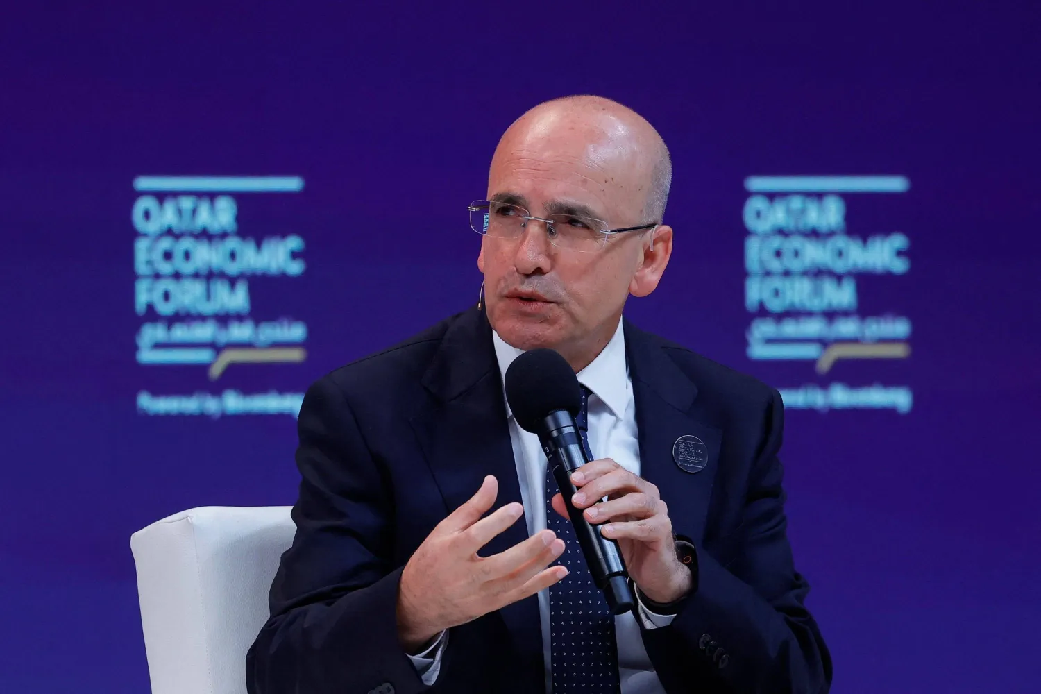 Turkish Finance Minister Mehmet Simsek speaks during a session at the Qatar Economic Forum, Doha, Qatar, May 20, 2025. (AFP) 