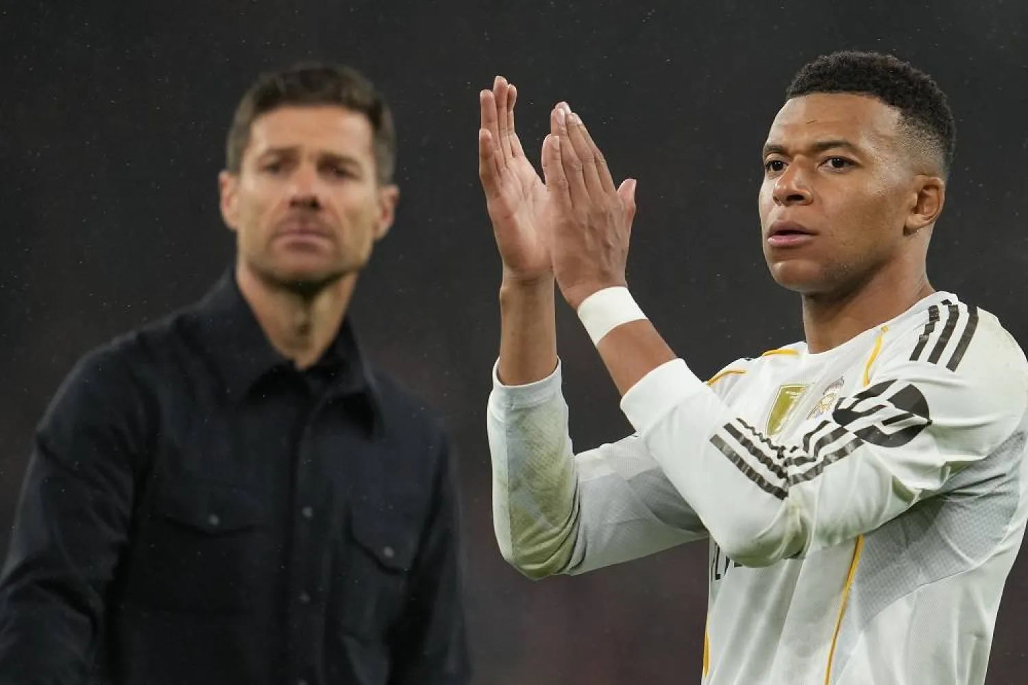 Real Madrid's head coach Xabi Alonso and Kylian Mbappe walk off the pitch after the Champions League soccer match between Liverpool and Real Madrid in Liverpool, England, Tuesday, Nov. 4, 2025. (AP)