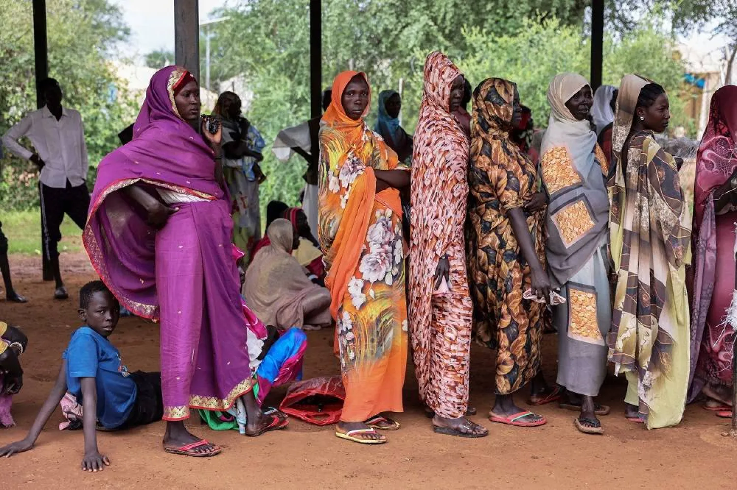  Women wait for cash assistance and dry grain from the UN World Food Program in Gendrassa refugee camp, Maban, South Sudan, on Aug. 20, 2025. (AP)