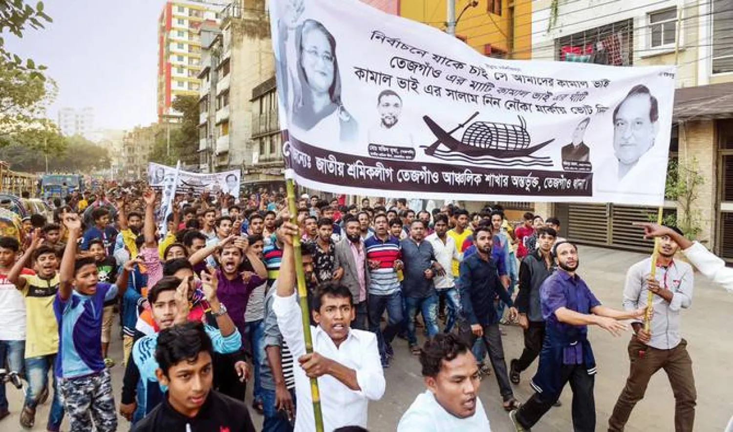 Bangladesh Awami League supporters during a general election campaign procession in Dhaka on Monday. (AFP)
