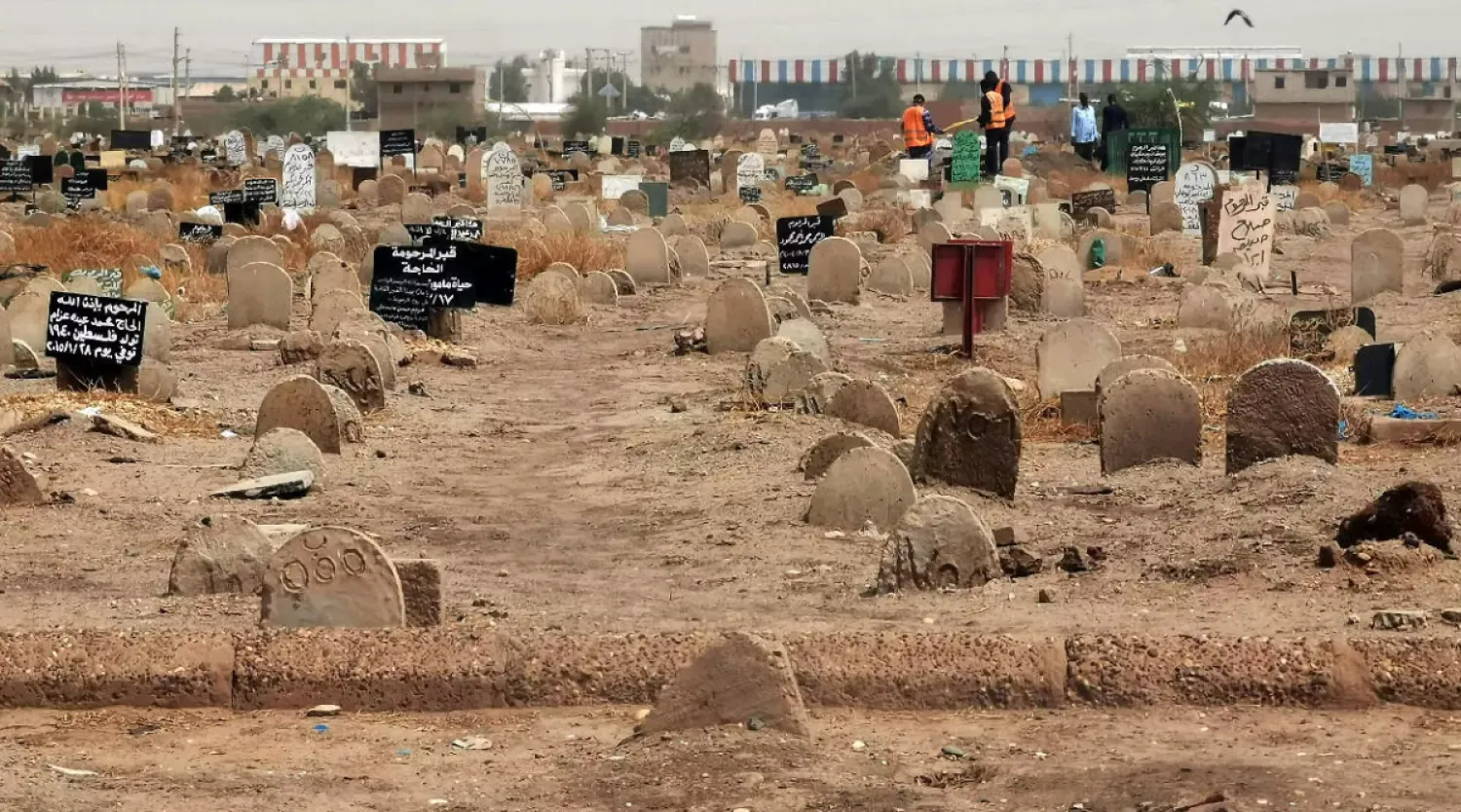 A picture taken on June 13, 2020, shows members of a forensic team at a cemetary, where a mass grave of conscripts killed in 1998 was discovered, in the Sahafa neighbourhood, south of the Sudanese capital Khartoum. © AFP (File Photo)
