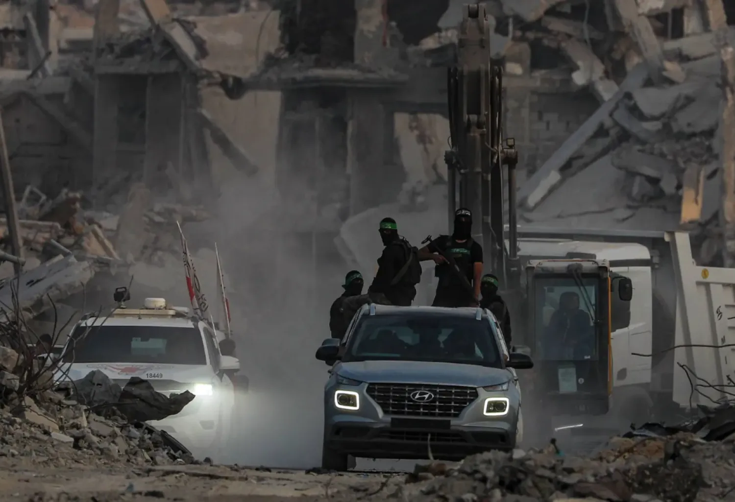 Fighters from the Qassam Brigades, Hamas’s military wing, in Gaza City’s Al Shujaiya district, November 5, 2025 (EPA)