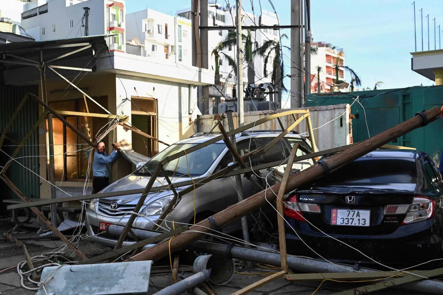 A man looks at damage caused by typhoon Kalmaegi in the Quy Nhon coastal area of Gia Lai province, central Vietnam on November 7, 2025. (AFP)