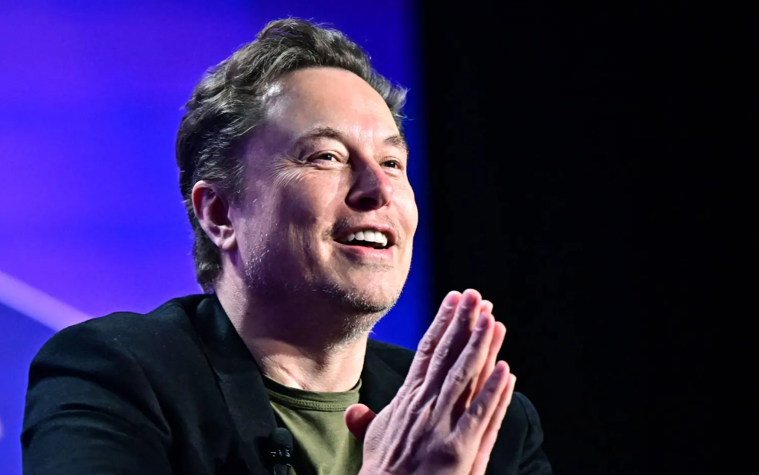 Tesla CEO Elon Musk speaks at the 27th annual Milken Institute Global Conference at the Beverly Hilton in Los Angeles on May 6, 2024. (AFP)