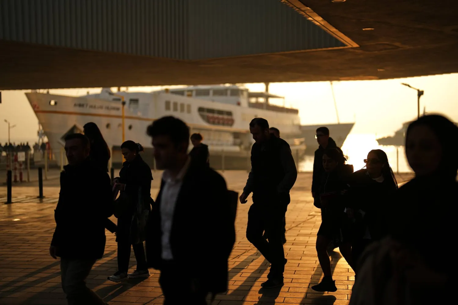 Commuters arrive at the Kabatas ferry terminal next to the Bosphorus strait, in Istanbul, Türkiye, Tuesday, Nov. 4, 2025. (AP) 