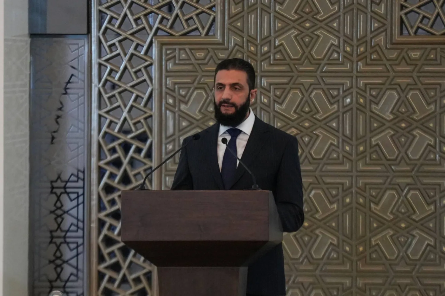 29 March 2025, Syria, Damascus: Syria's President Ahmed al-Sharaa speaks during the ceremony announcing the new Syrian government at the People's Palace. (dpa)