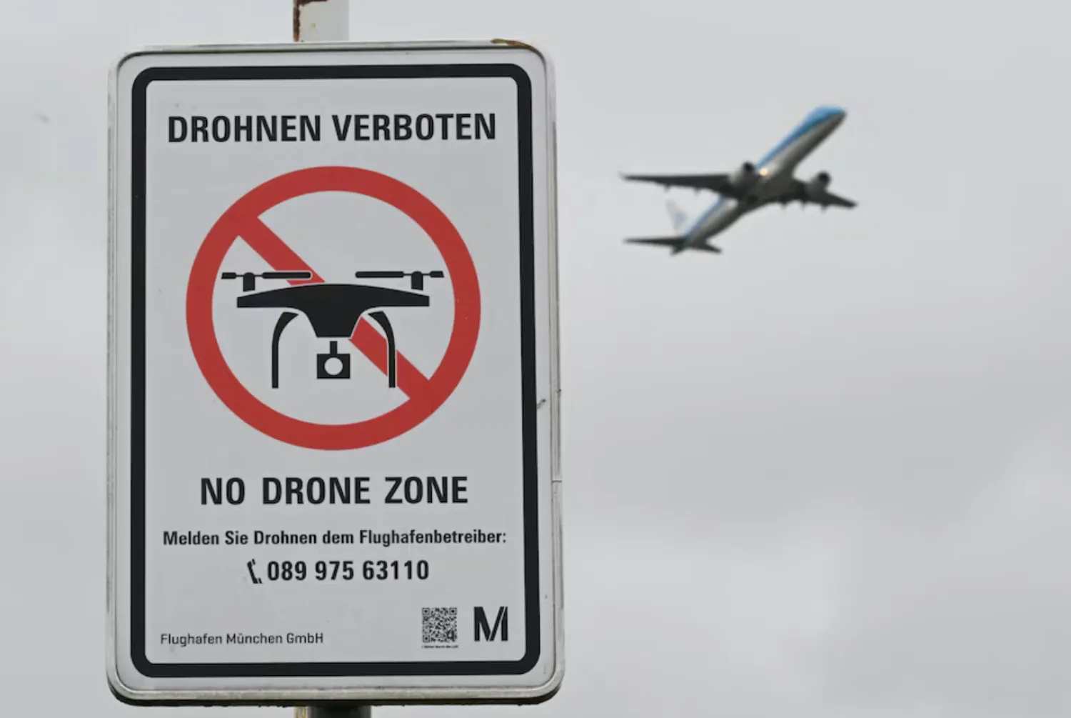 A sign with a drone ban is displayed outside the airport in Munich, Germany October 6, 2025. REUTERS/Angelika Warmuth/File 