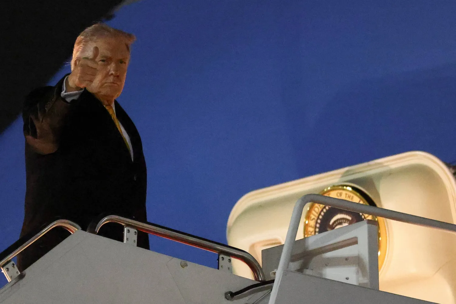 US President Donald Trump gestures as he boards Air Force One as he departs for Florida from Joint Base Andrews in Maryland, US, November 7, 2025.  REUTERS/Kevin Lamarque