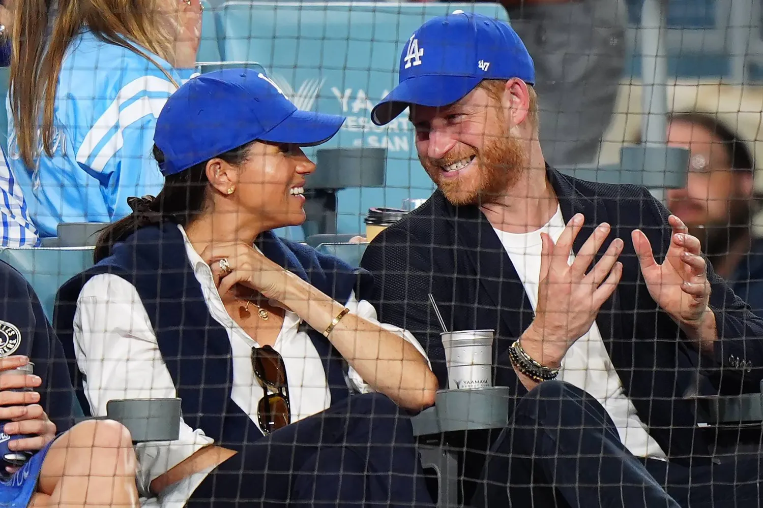 Prince Harry (right) and Meghan Markle sit during the eight inning between the Toronto Blue Jays and the Los Angeles Dodgers during Game 4 of the 2025 MLB World Series at Dodger Stadium (Shutterstock)
