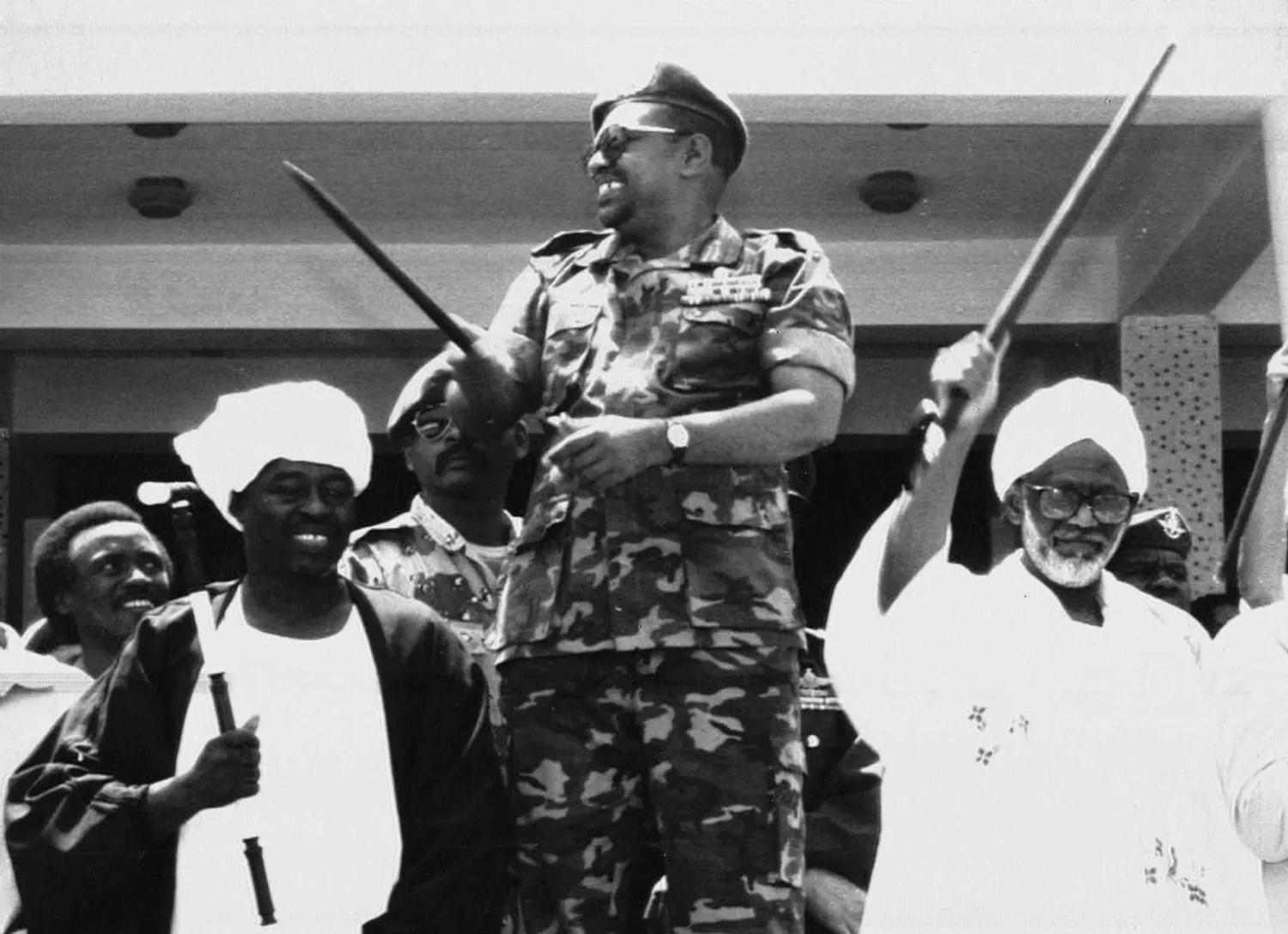  
Al-Bashir and al-Turabi (right) after the coup (AP)
