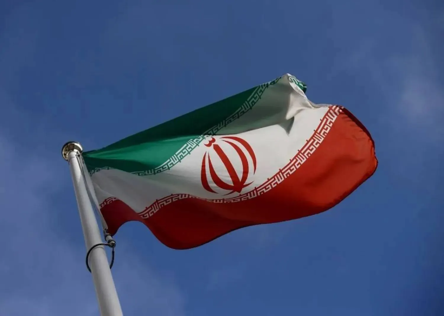 The Iranian flag waves in front of the International Atomic Energy Agency (IAEA) headquarters, before the beginning of a board of governors meeting, amid the coronavirus disease (COVID-19) outbreak in Vienna, Austria, March 1, 2021. (Reuters)

