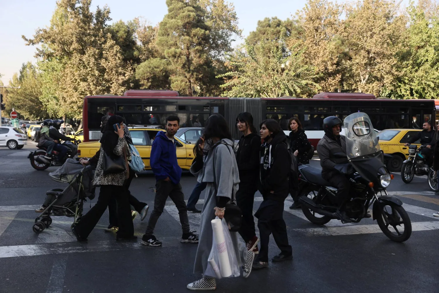 People walk on a street in Tehran, Iran, November 5, 2025. Majid Asgaripour/WANA (West Asia News Agency) via Reuters