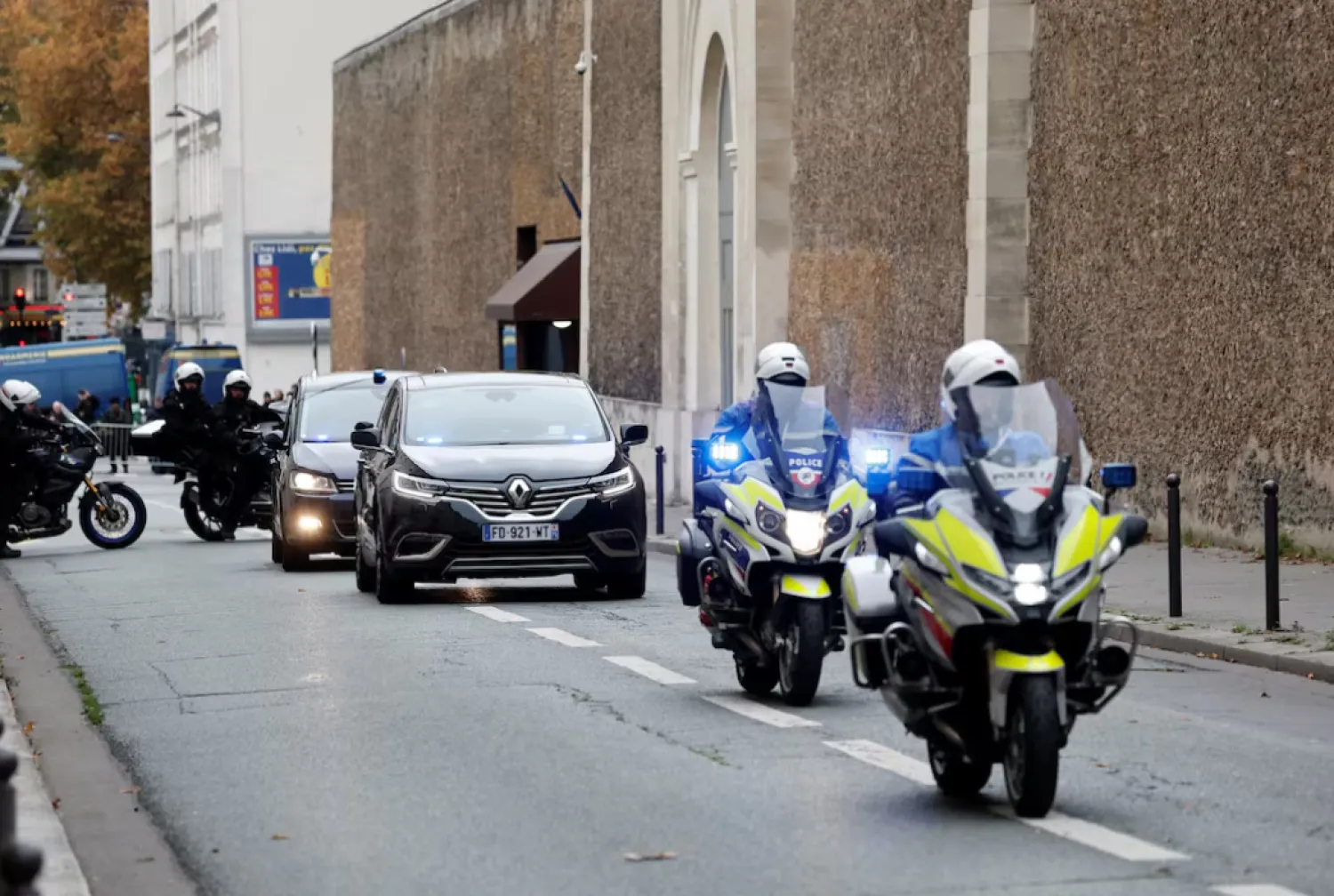 Vehicles believed to be carrying former French President Nicolas Sarkozy leave the Sante prison, after a Paris court granted him an early release from jail, pending an appeal, weeks after he started a five-year sentence for conspiring to raise campaign funds from Libya, in Paris, France - AP