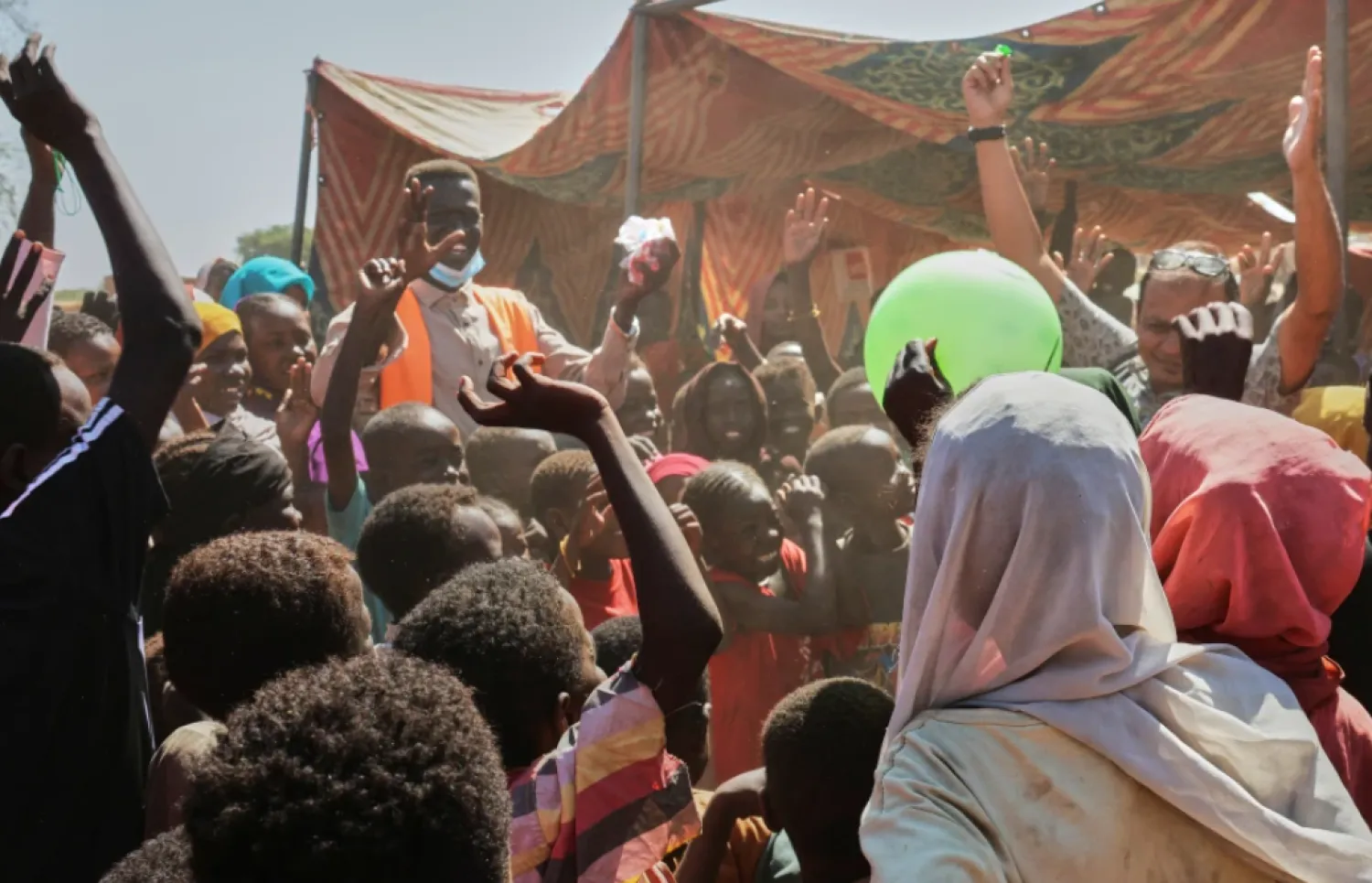 CORRECTS BYLINE.- This photo released by The Norwegian Refugee Council (NRC), shows displaced children from el-Fasher playing at a camp where they sought refuge from fighting between government forces and the RSF, in Tawila, Darfur region, Sudan, Monday, Nov. 3, 2025. (Sarah Vuylsteke/NRC via AP)

