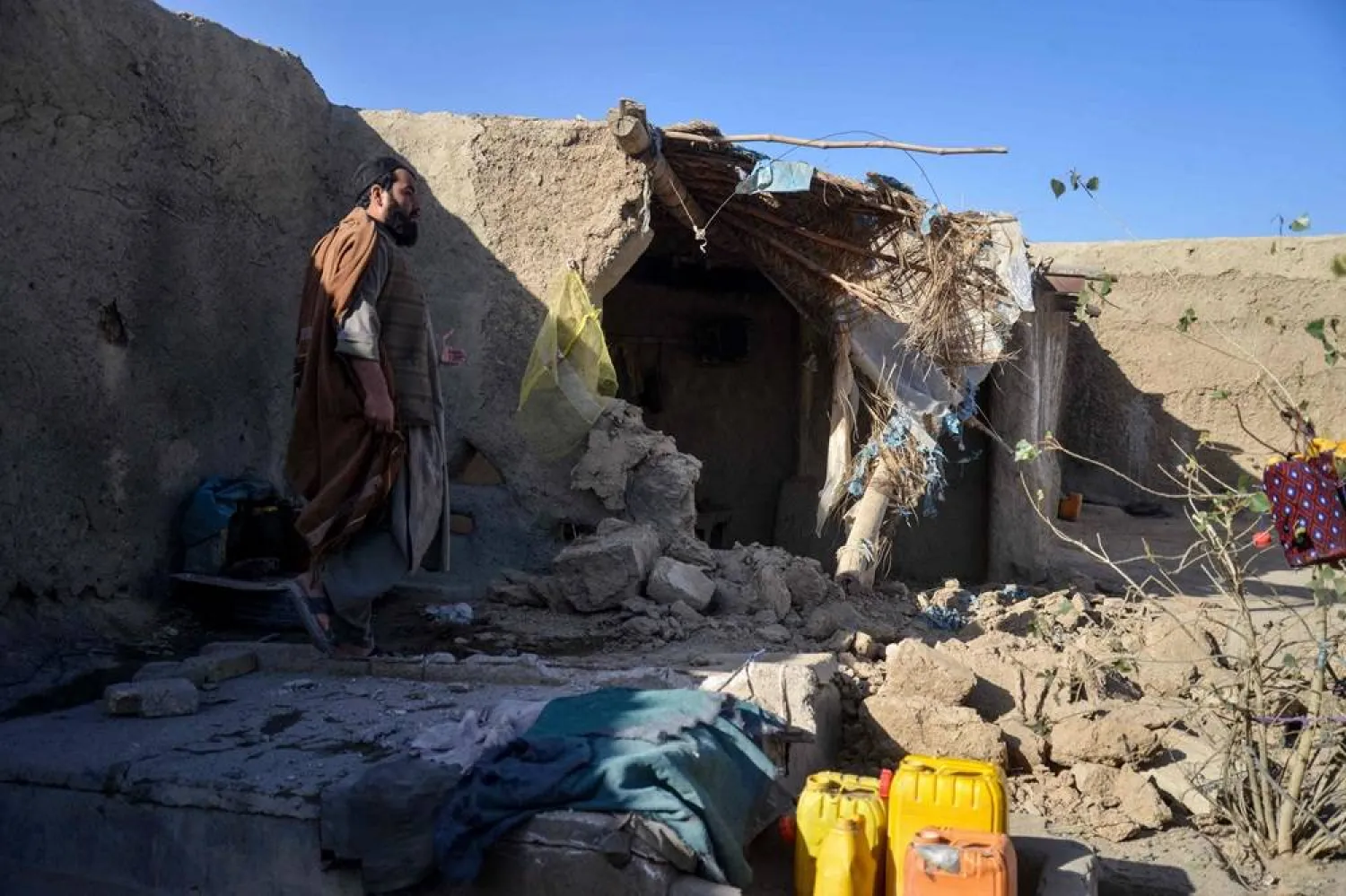 An Afghan man inspects a damaged house, following cross-border fire from Pakistan's artillery shelling, at a village in the Spin Boldak district of Kandahar on November 7, 2025. (AFP)