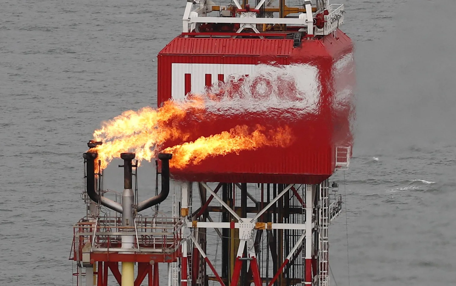 A Lukoil company sign at the Filanovskogo oil platform in the Caspian Sea, Russia, October 16, 2018. (Reuters) 