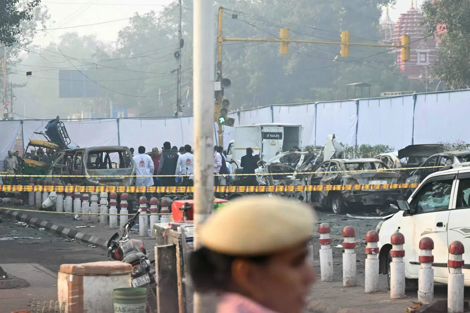  Forensic experts investigate at the blast site following an explosion near the Red Fort in the old quarters of Delhi on November 11, 2025. (AFP)