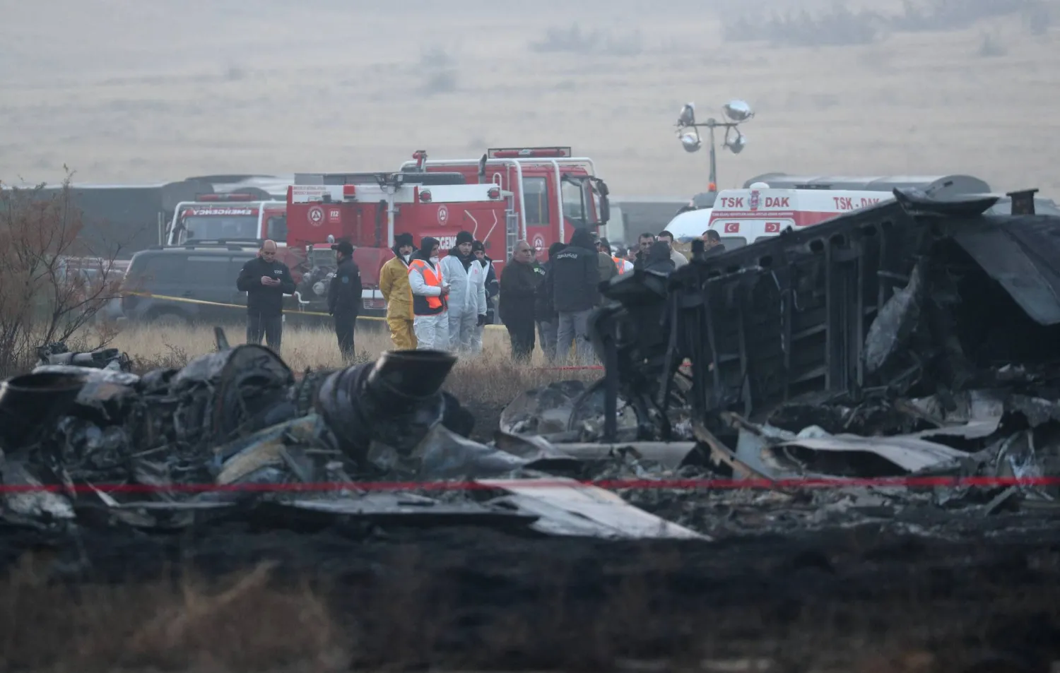 Members of emergency services work at the site of the Turkish C-130 military cargo plane crash near the Azerbaijani border, in Sighnaghi municipality, Georgia, November 12, 2025. REUTERS/Irakli Gedenidze