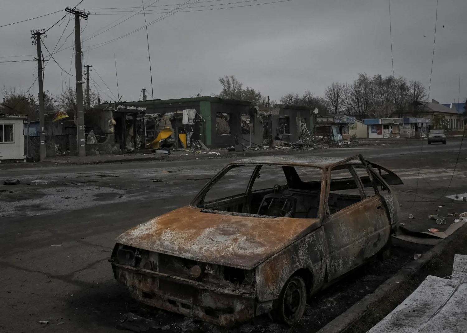 A damaged car lies in the frontline town of Pokrovske, amid Russia's attack on Ukraine, in Dnipropetrovsk region, Ukraine November 11, 2025. (Reuters)