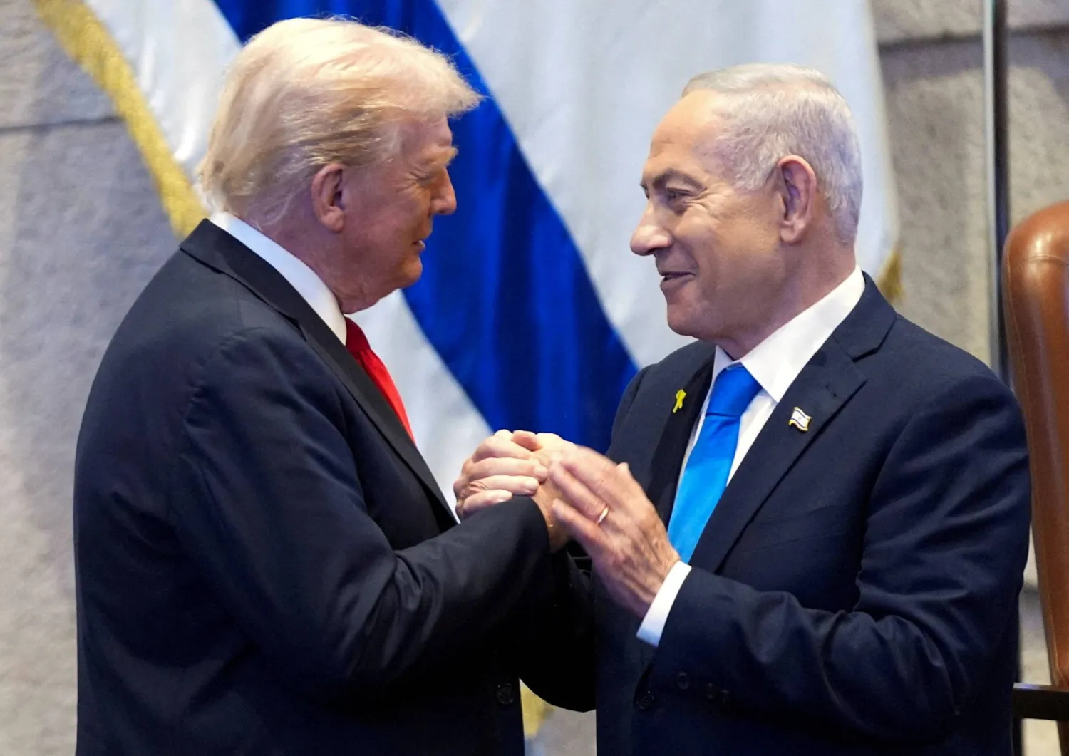 President Donald Trump talks with Israel's Prime Minister Benjamin Netanyahu at the Knesset, Monday, Oct. 13, 2025, in Jerusalem. (Reuters) 