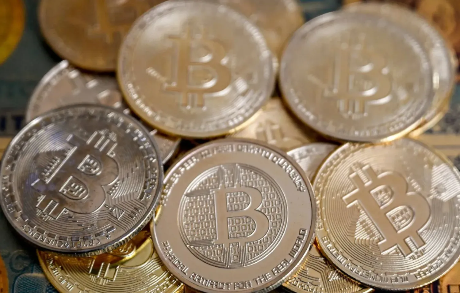 (FILES) This illustration photograph taken on November 22, 2024 in Istanbul shows coin imitations of Bitcoin. (Photo by Ozan KOSE / AFP)