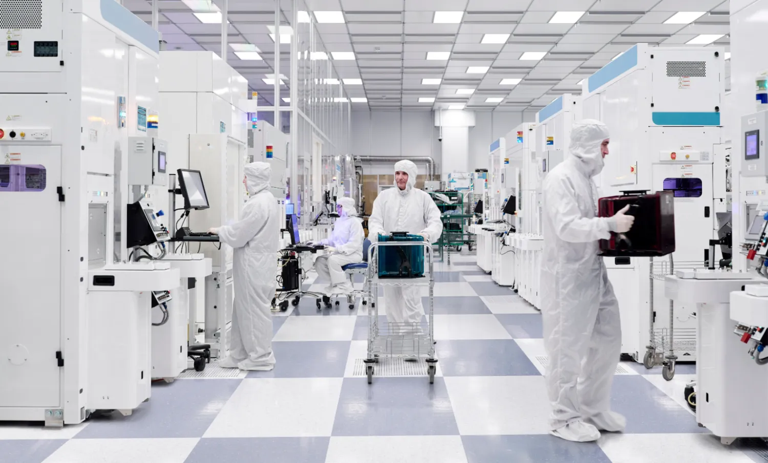 People work at a cleanroom that manufactures 300 millimeter silicon wafers containing quantum computing chips at the Albany NanoTech Complex in Albany, New York., US, in this handout image released on November 10, 2025. IBM/Handout via REUTERS 