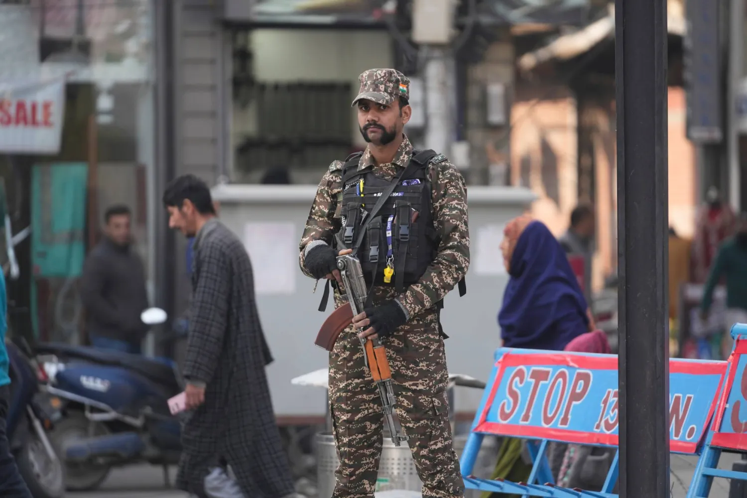 An Indian soldier stands guard in Srinagar, Indian controlled Kashmir, Wednesday, Nov. 12, 2025. (AP Photo/Mukhtar Khan)