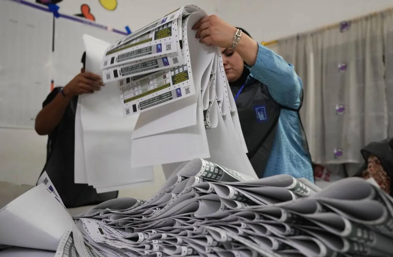  Election workers count ballots as they close a polling station, during the parliamentary election in Baghdad, Iraq, Tuesday, Nov. 11, 2025. (AP) 