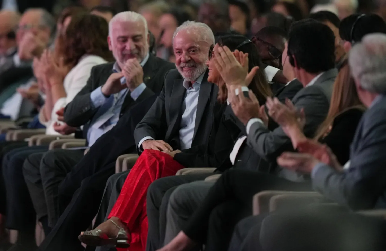 Brazil President Luiz Inacio Lula da Silva, center, reacts during a plenary session at the COP30 UN Climate Summit, Monday, Nov. 10, 2025, in Belem, Brazil. (AP Photo/Fernando Llano)

