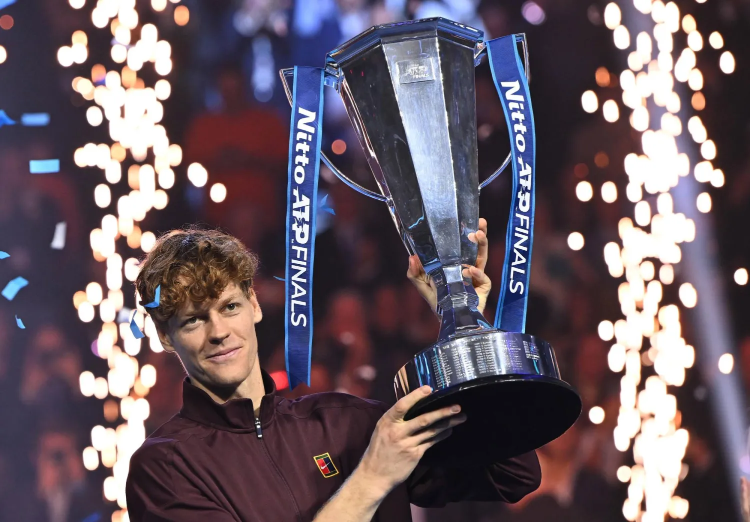 Jannik Sinner of Italy celebrates with the trophy after winning the men's singles final match against Carlos Alcaraz of Spain at the ATP Finals in Turin, Italy, 16 November 2025.  EPA/ALESSANDRO DI MARCO