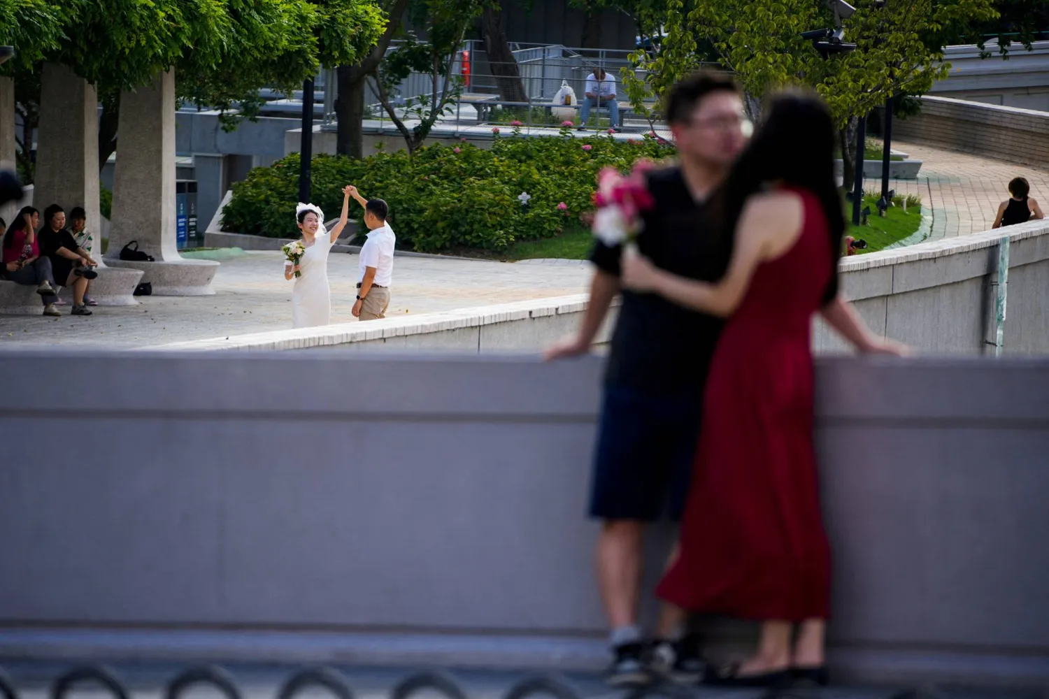 FILE PHOTO: Couples prepare to get their photo taken during a wedding photography shoot on a street, in Shanghai, China September 6, 2023. REUTERS/Aly Song/File Photo