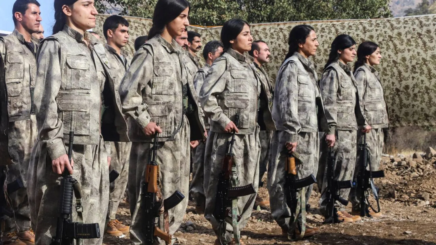 A first group of 25 PKK fighters who had left Türkiye for northern Iraq were at the ceremony, among them eight women. Shwan MOHAMMED / AFP
