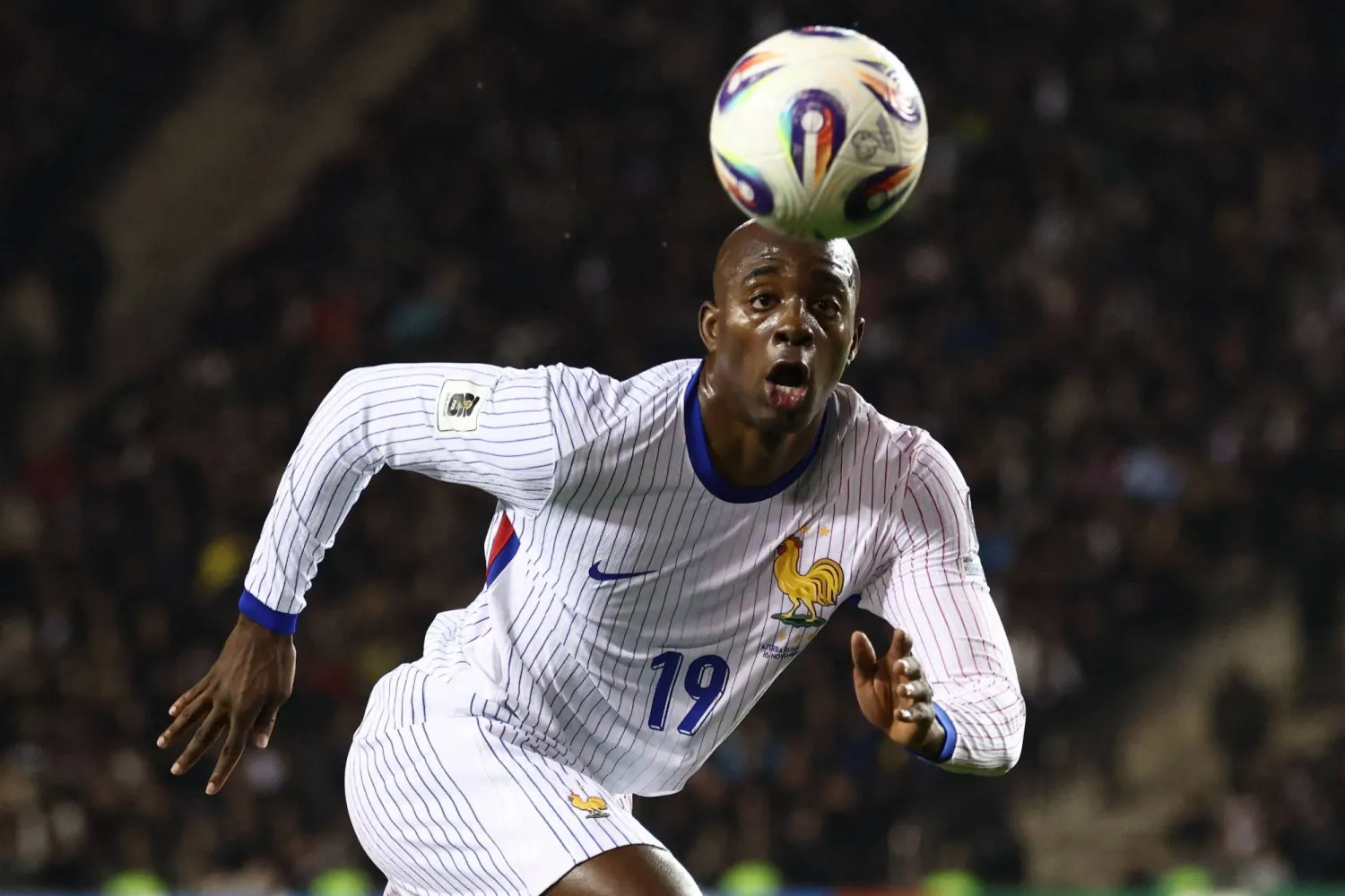 France's forward #19 Jean-Philippe Mateta eyes the ball during the FIFA World Cup 2026 European qualification football match between Azerbaijan and France at the Tofiq Bahramov Republican Stadium in Baku on November 16, 2025. (AFP)