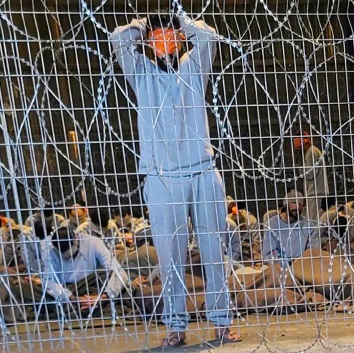 This undated photo from winter 2023 provided by Breaking The Silence, a whistleblower group of former Israeli soldiers, shows blindfolded Palestinian prisoners captured in the Gaza Strip by Israeli forces at a detention facility on the Sde Teiman military base in southern Israel. (Breaking The Silence via AP, File)

