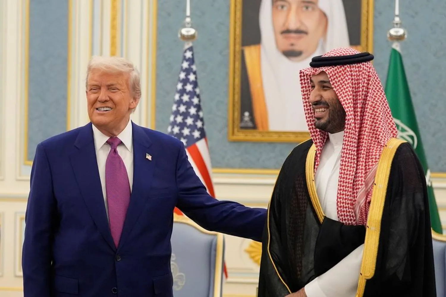 President Donald Trump and Crown Prince Mohammed bin Salman bin Abdulaziz Al Saud, Saudi Crown Prince and Prime Minister, gesture as they meet delegations at the Royal Palace in Riyadh, Saudi Arabia, May 13, 2025. (AP) 