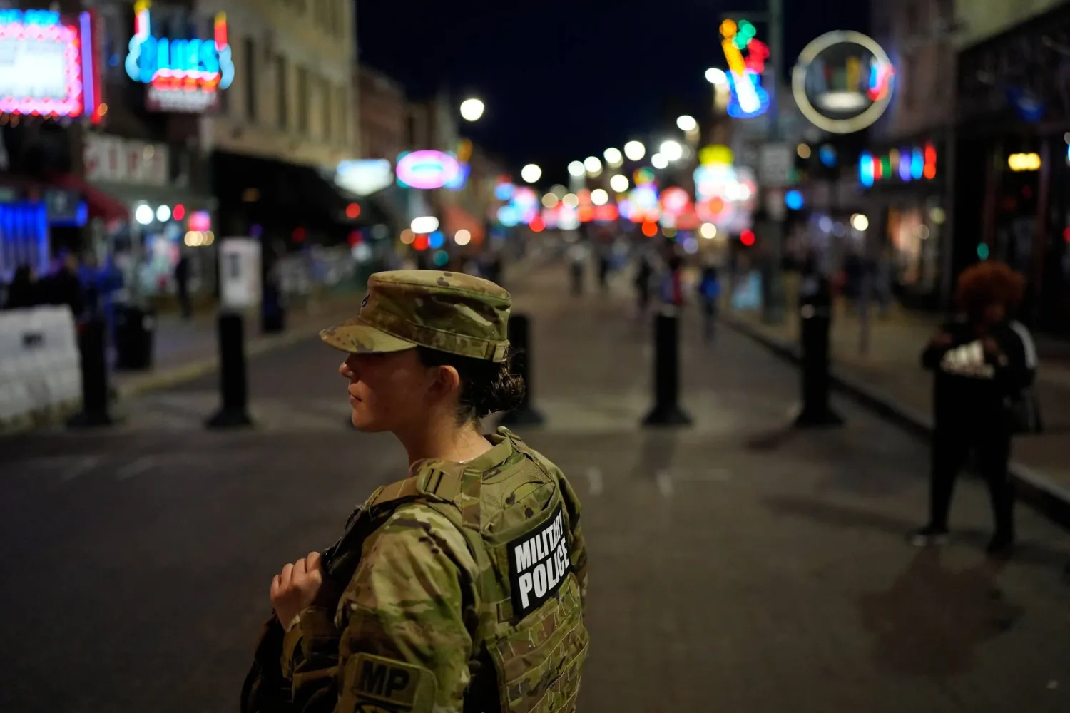 FILE - A member of the National Guard stands watch on Beale Street Oct. 24, 2025, in Memphis, Tenn. (AP Photo/George Walker IV, File)