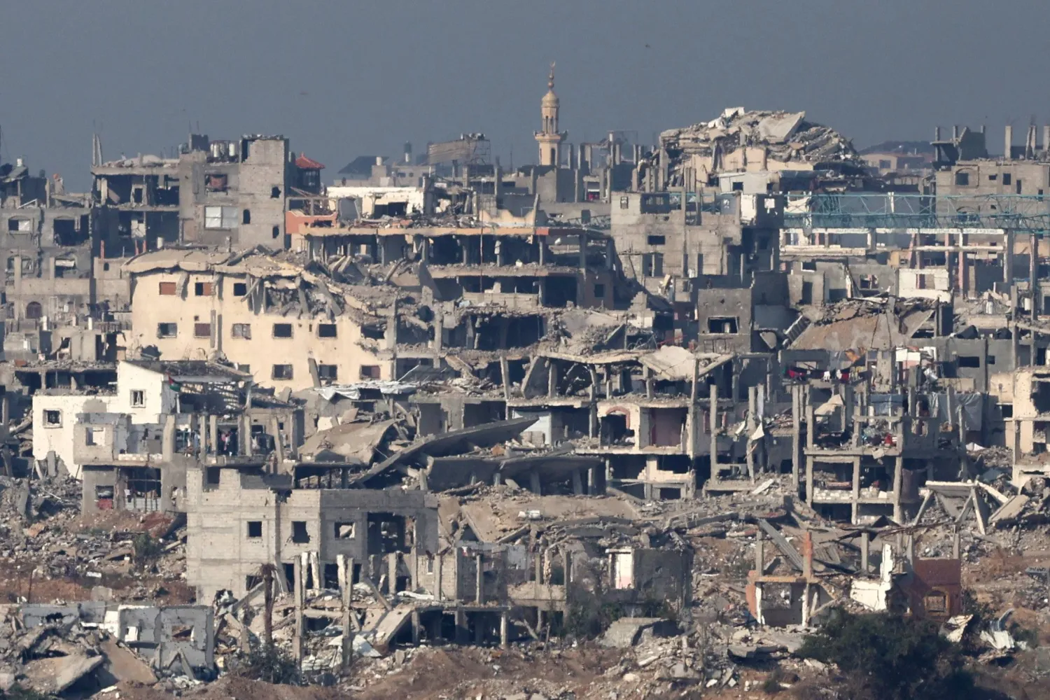 The ruins of damaged buildings in the Bureij area of the Gaza Strip as seen from the border in southern Israel, 18 November 2025, amid a ceasefire between Israel and Hamas. (EPA)